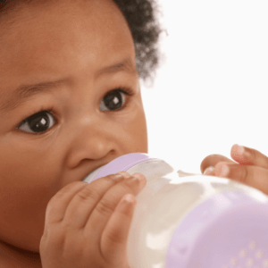 A baby drinking milk from a bottle--BPA