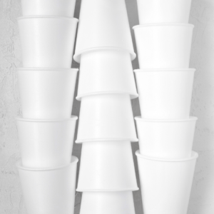 Three stacks of styrofoam cups standing next to each other--Styrofoam