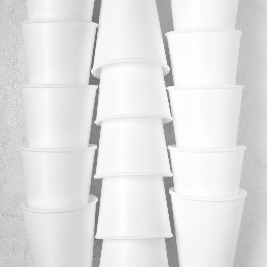Three stacks of styrofoam cups standing next to each other--Styrofoam