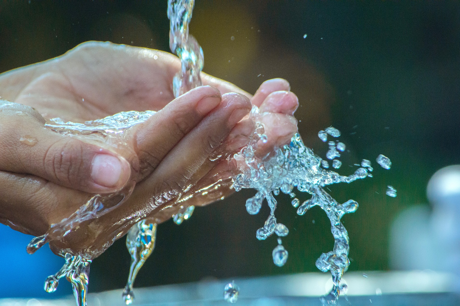 Water splashing onto someone's cupped hands--Arsenic