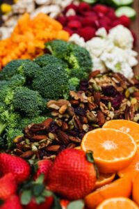 An arrangement of colorful fruits, vegetables, and nuts on display