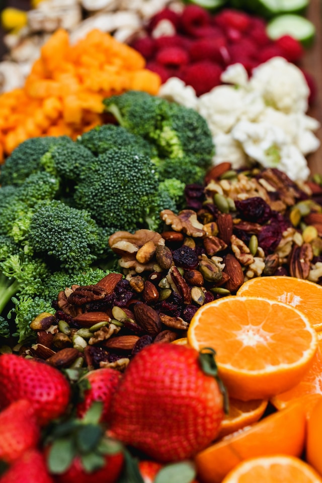 An arrangement of colorful fruits, vegetables, and nuts on display