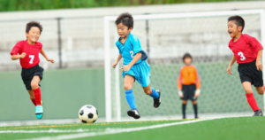 Children Playing Soccer on a Turf Field--artificial turf