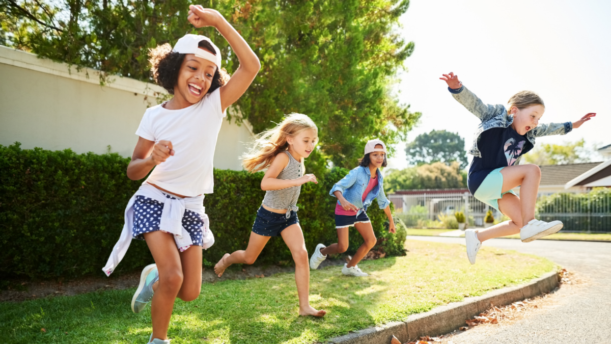 Four children jumping and running together -- Delaware children's environmental health