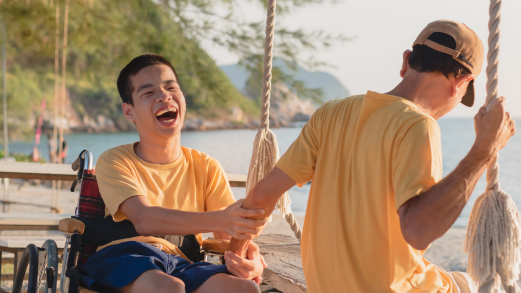 Child holding an adult's hand on a beach - Hawaii children's environmental health