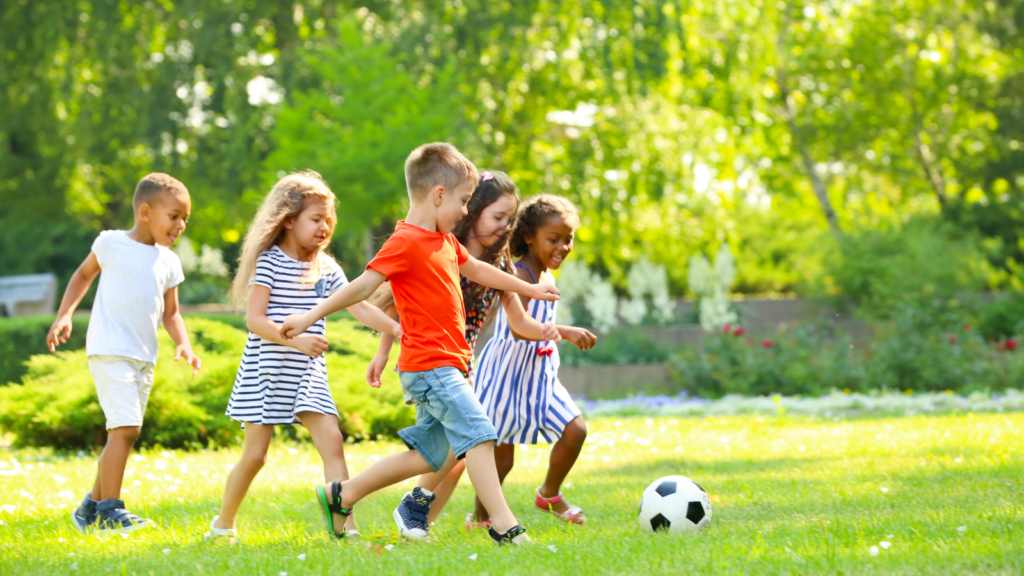 Children playing soccer outside - Illinois children's environmental health
