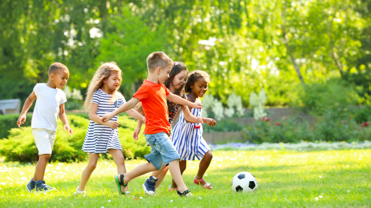 Children playing soccer outside - Illinois children's environmental health