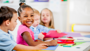 Children sitting at a table and coloring - Massachusetts children's environmental health