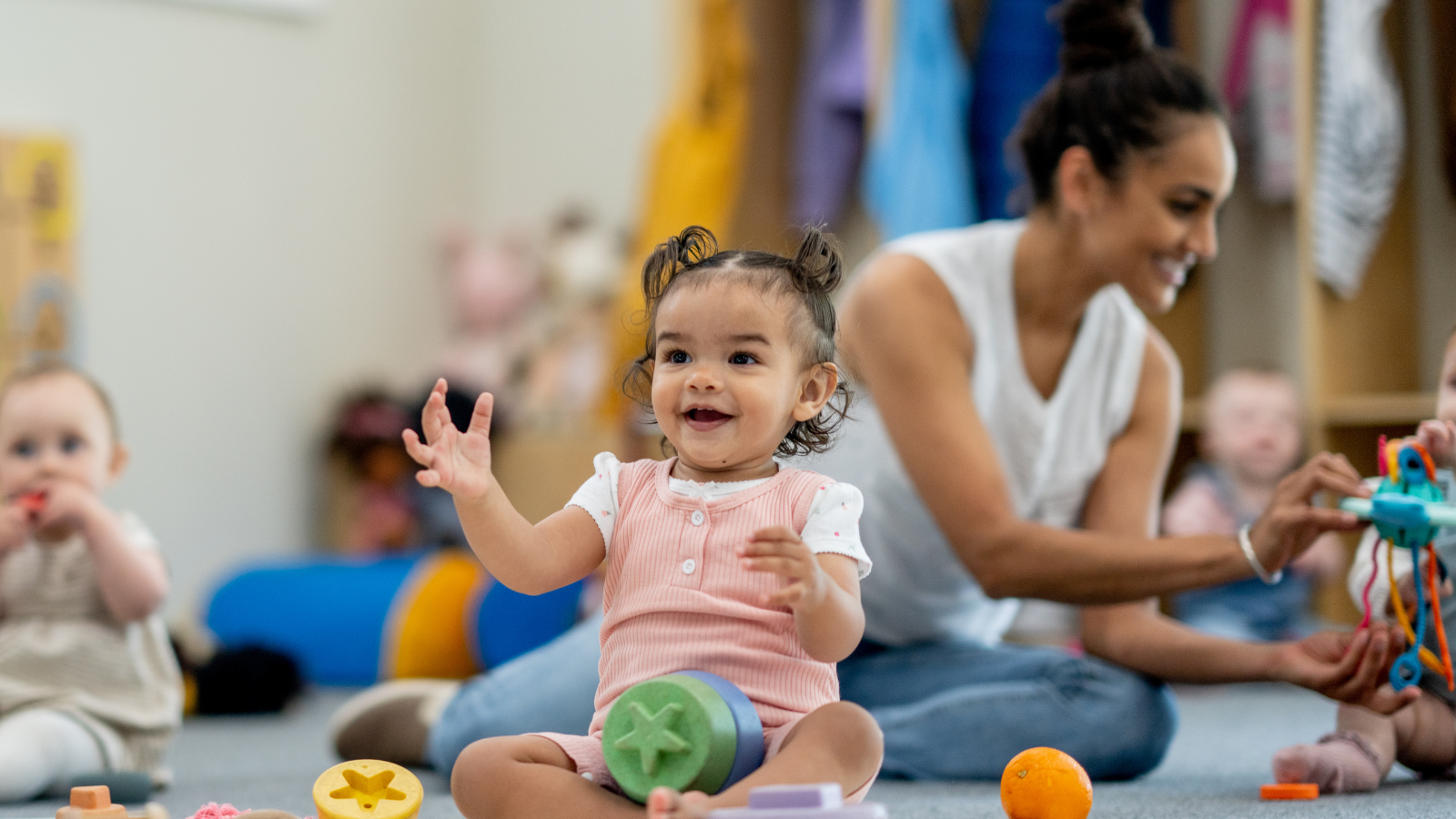 Children sitting with toys at a school -- Texas children's environmental health