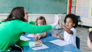 Group of children sitting with an adult in a classroom -- Virginia children's environmental health