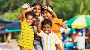 Four children smiling and waving -- Oregon children's environmental health