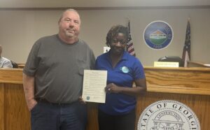 CEH Day partners stand with a proclamation